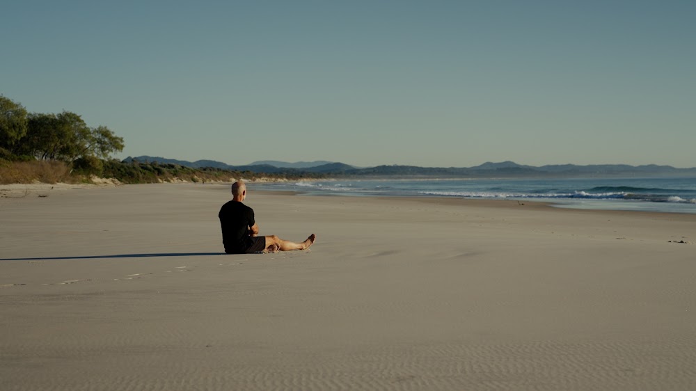 Running on an open beach at dawn